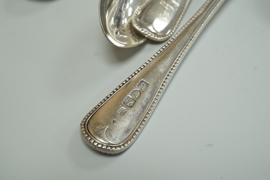 A harlequin part canteen of late Victorian and Edwardian silver beaded Old English pattern flatware, various dates and makers, comprising thirty items, 55.8oz.